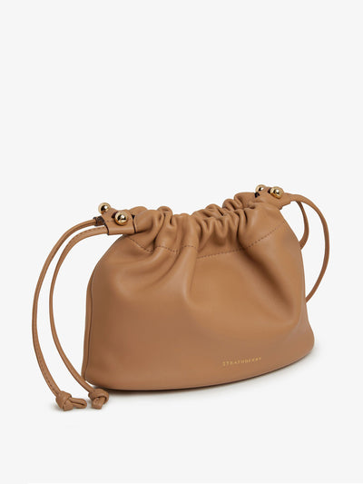 Strathberry Caramel Charlotte drawstring bag at Collagerie