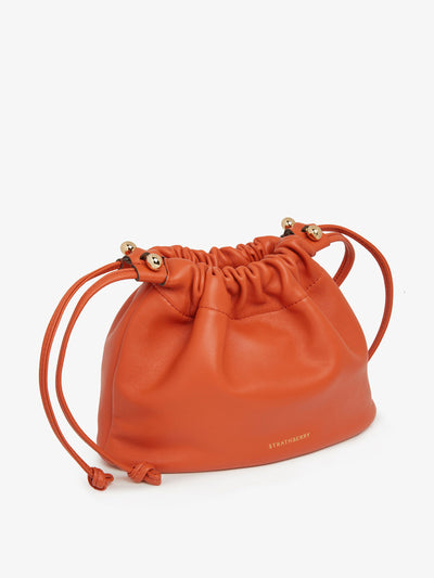 Strathberry Marmalade Charlotte drawstring bag at Collagerie