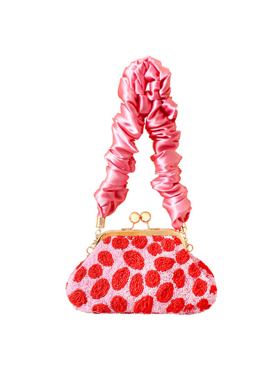 BrunnaCo Arnoldi daisy hand-beaded clutch in pink and red at Collagerie