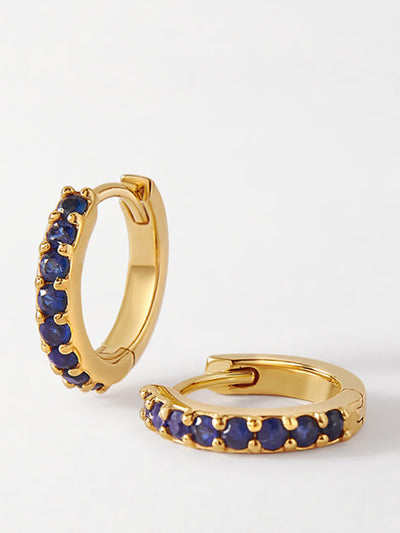 Edge of Ember Blue sapphire pavé huggie earrings at Collagerie