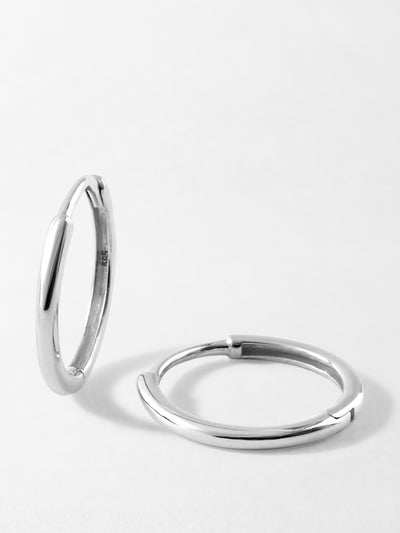 Edge of Ember White gold medium classic hoop earrings at Collagerie