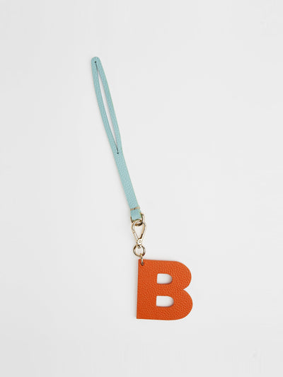 London Velvet The orange and baby blue letter charm at Collagerie