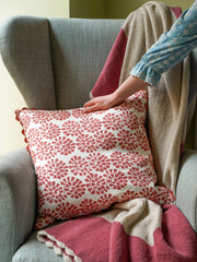 Pink bordered knitted throw