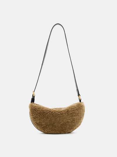 All Saints Half-Moon shearling crossbody bag at Collagerie