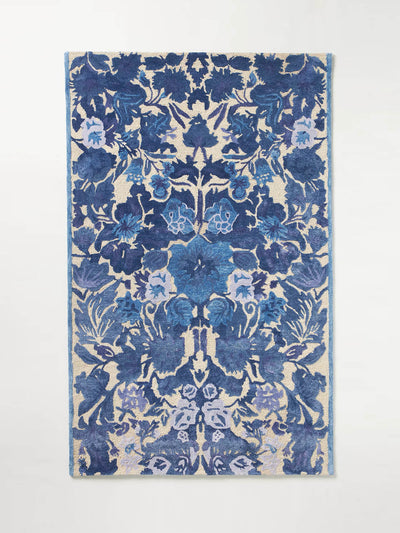 Anthropologie Hand-tufted blue floral rug at Collagerie