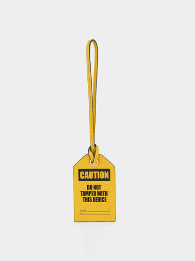 Anya Hindmarch Caution luggage label charm at Collagerie