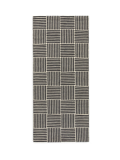 Arket Woven cotton and wool rug in black and off-white at Collagerie