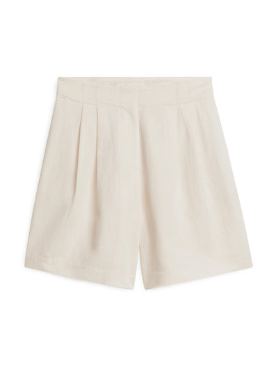 Arket Cream oversized linen shorts at Collagerie