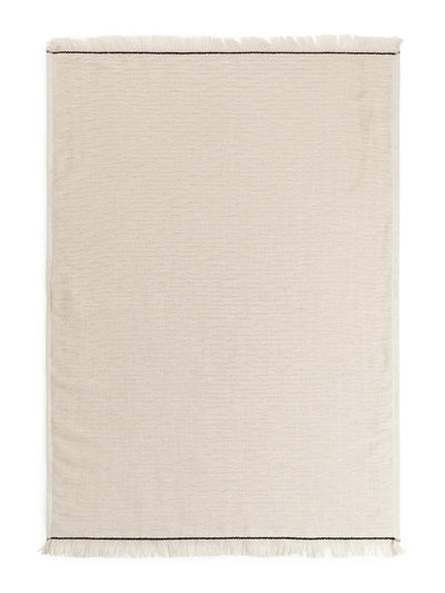 Arket Beige cotton hand towel at Collagerie