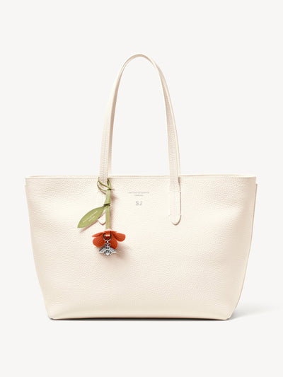 Aspinal Of London Zipped east west tote with bee & flower charm at Collagerie