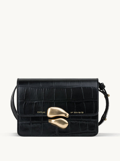 Chylak Black mini leather bag with gold sculptural seal at Collagerie