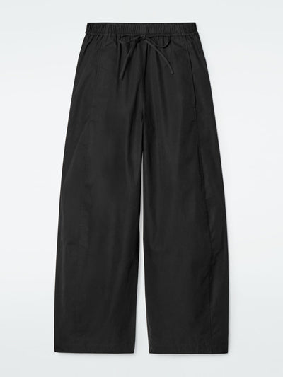 Cos Elasticated barrel-leg trousers at Collagerie