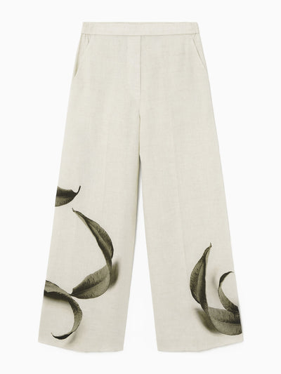 Cos Leaf-print linen trousers at Collagerie
