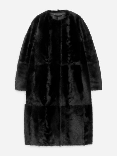 Arket Shearling coat at Collagerie