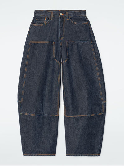 Cos Western barrel-leg raw denim trousers at Collagerie