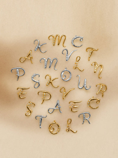 Dower & Hall Gold vermeil & diamond letter pendants at Collagerie