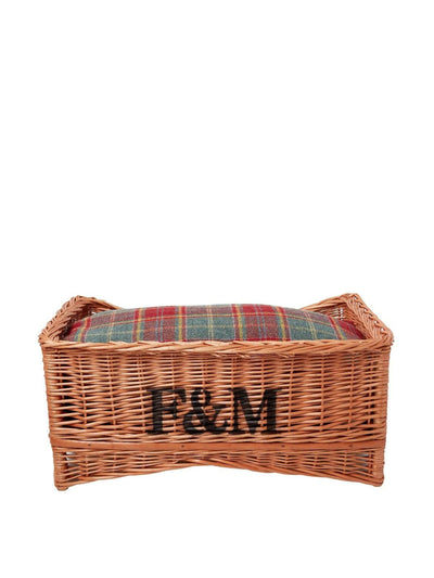 Fortnum & Mason Wicker pet bed with tartan pillow at Collagerie