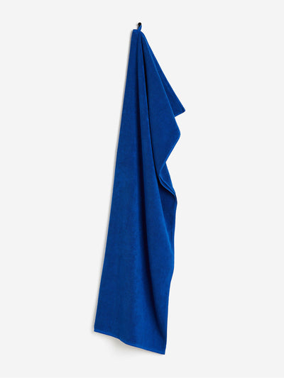 H&M Home Cotton terry bath towel in blue at Collagerie
