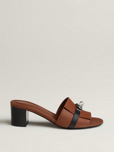 Hermès Gigi 50 sandal in Gold/Noir at Collagerie