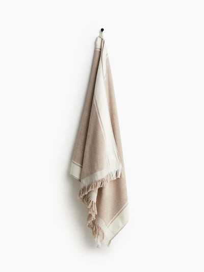 H&M Home Fringed beach towel at Collagerie