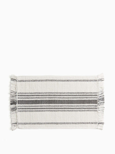 H&M Home Fringed cotton bath mat at Collagerie