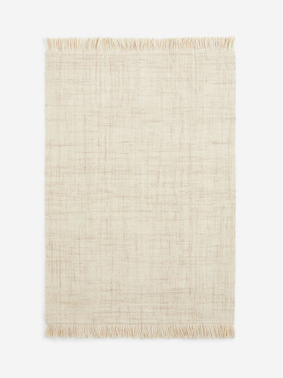 H&M Home Fringed wool-blend rug at Collagerie