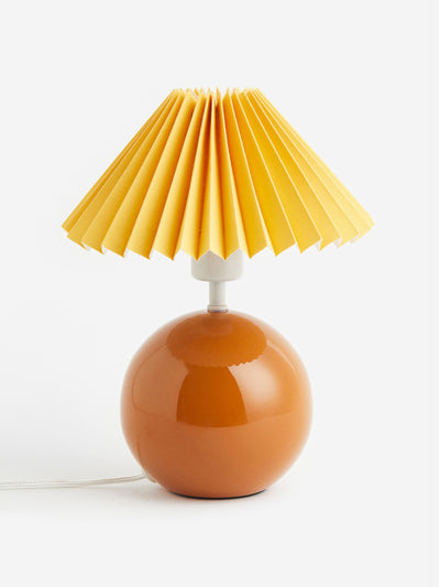 H&M Home Orange orb-shaped lamp base at Collagerie