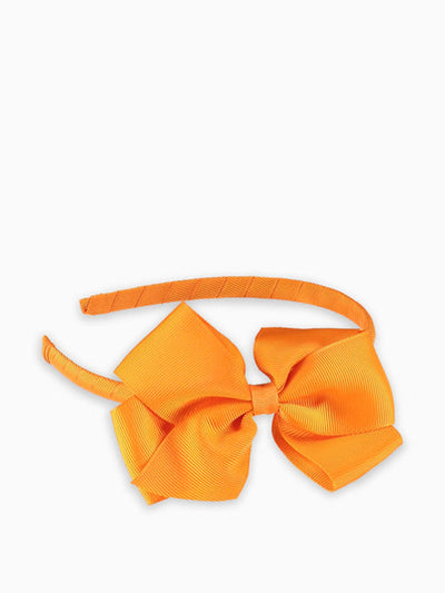 La Coqueta Kids Orange big bow hairband at Collagerie