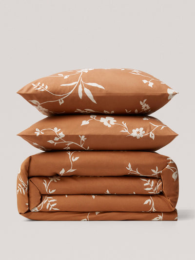 Mango Duvet cover terracotta flowers queen bed at Collagerie