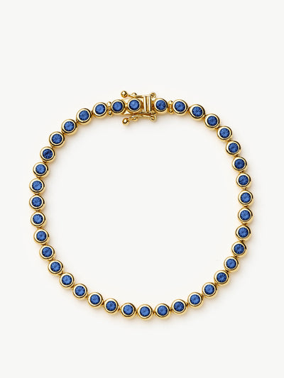 Missoma Tennis round bracelet in gold vermeil and sapphire blue nano crystal at Collagerie