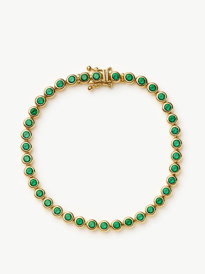 Missoma Tennis round bracelet in gold vermeil and emerald green nano crystal at Collagerie
