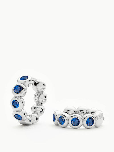 Missoma Tennis small hoop earrings in sterling silver and sapphire blue nano crystal at Collagerie