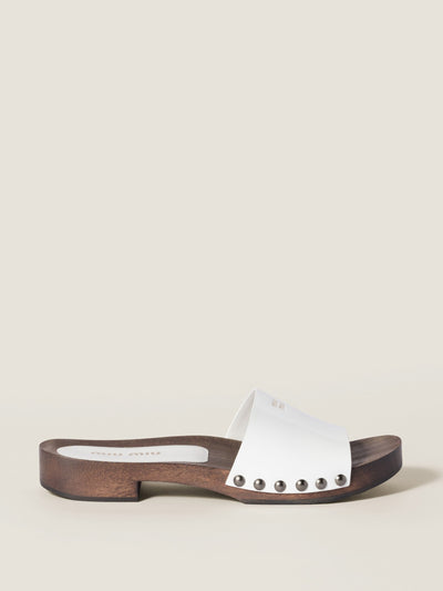 Miu Miu Patent leather clogs at Collagerie