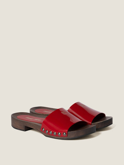 Miu Miu Patent leather clogs at Collagerie