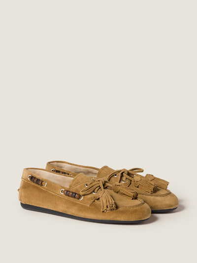 Miu Miu Suede tassel loafers at Collagerie
