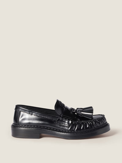Miu Miu Tassel loafers in polished leather at Collagerie