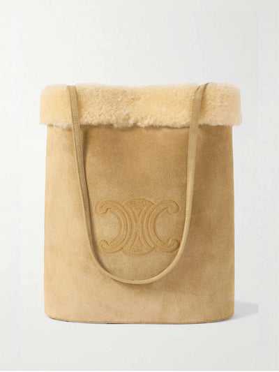 Celine Triomphe logo-embossed shearling bucket bag at Collagerie