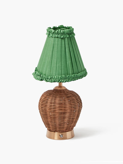Mrs. Alice Rattan ursula rechargeable lamp with green frilled silk shade at Collagerie