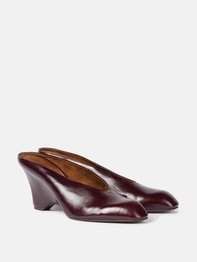 Khaite Colt 75 leather wedge mules at Collagerie