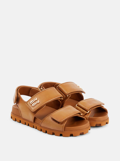 Miu Miu Logo leather sandals at Collagerie