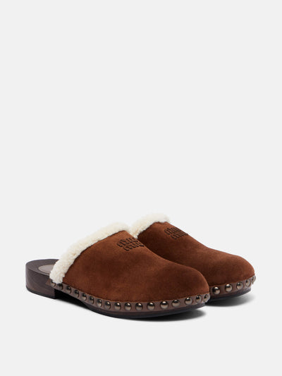 Miu Miu Shearling-lined suede clogs at Collagerie