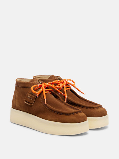 Miu Miu Suede platform ankle boots at Collagerie