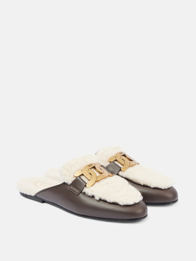 Tod's Catena shearling and leather mules at Collagerie