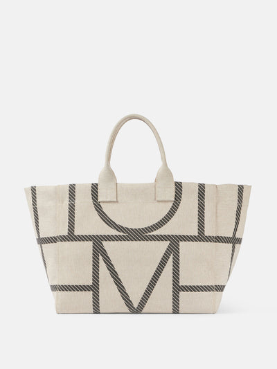 Totême Monogram canvas tote bag at Collagerie