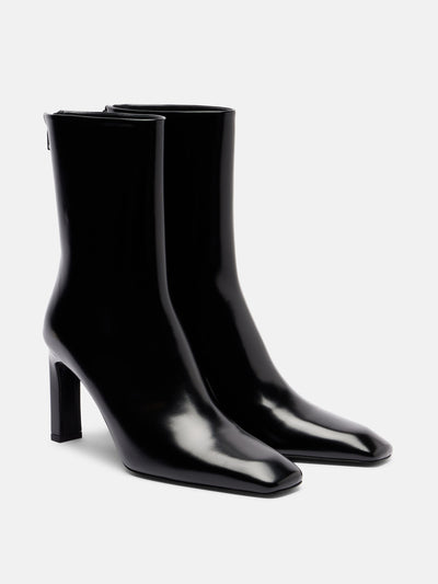 Totême Patent leather ankle boots at Collagerie