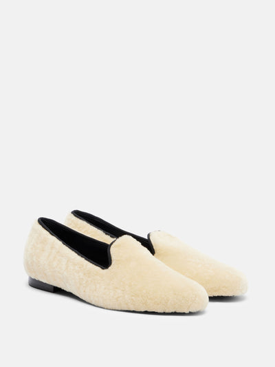 Totême Shearling loafers at Collagerie