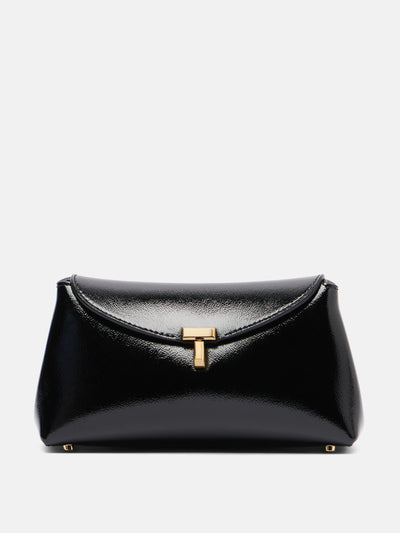 Totême T-Lock Mini patent leather clutch at Collagerie