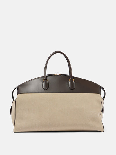 The Row George XL leather-trimmed denim duffel bag at Collagerie