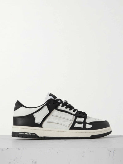 Amiri Black & white paneled leather trainers at Collagerie