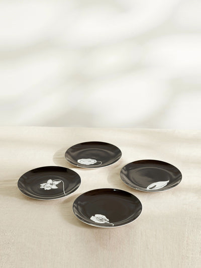 Anissa Kermiche Black porcelain plates (set of four) at Collagerie